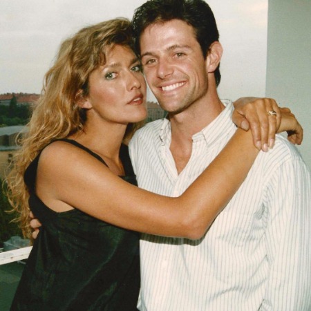 Caroline Cossey hugging her spouse David Finch.